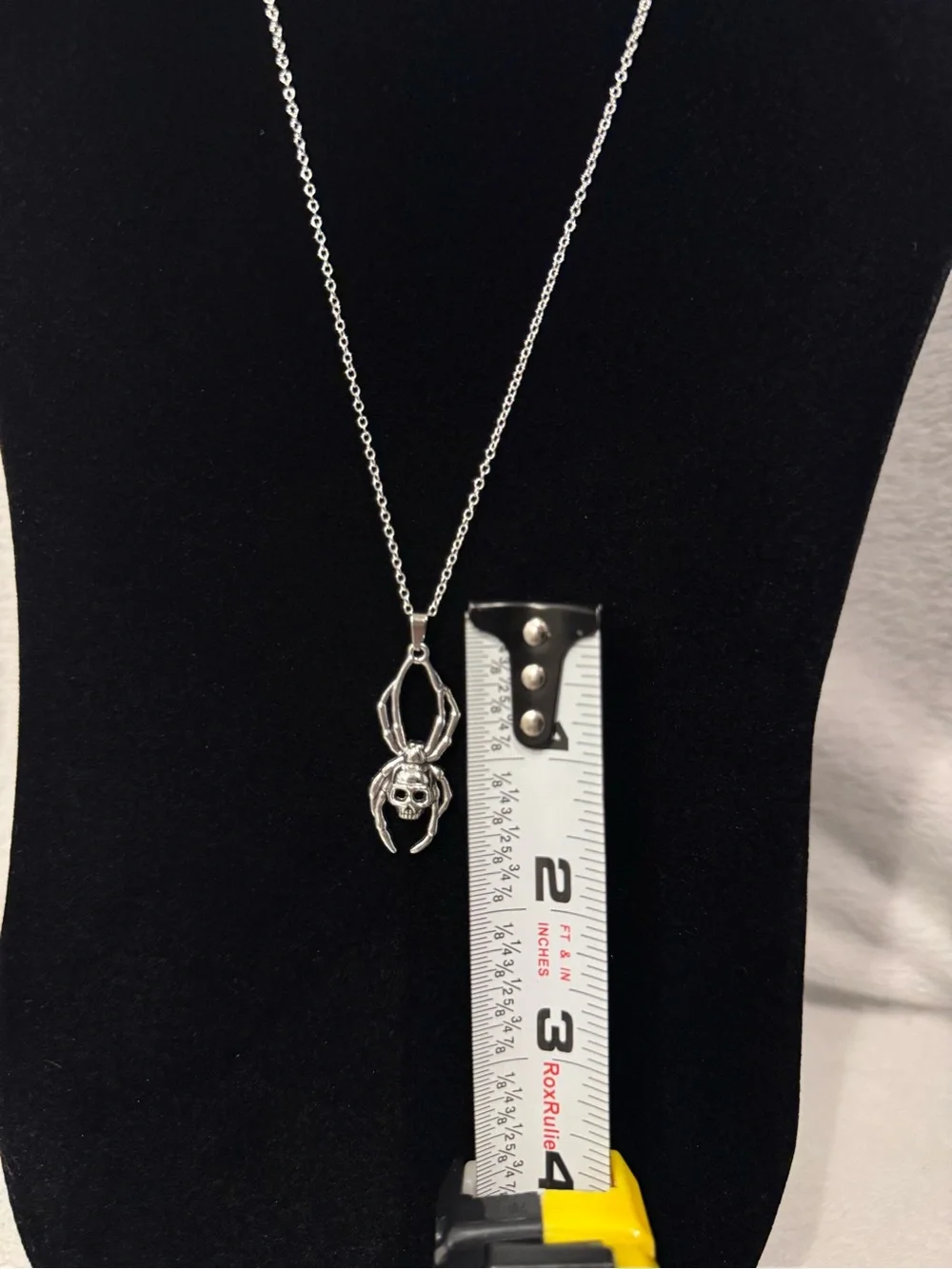Silver spider pendant necklace with skull design